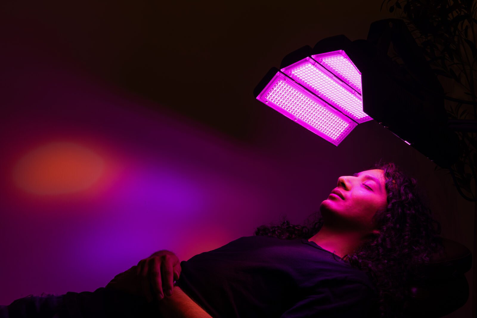 Patient under a layered red and blue light channel